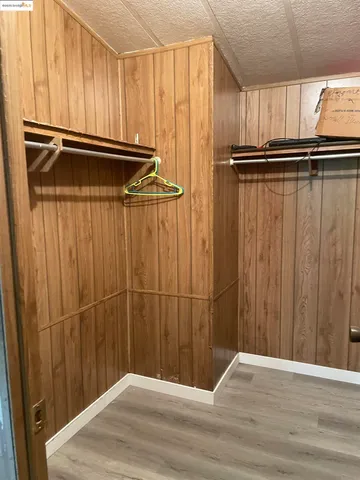 a view of a room with wooden walls