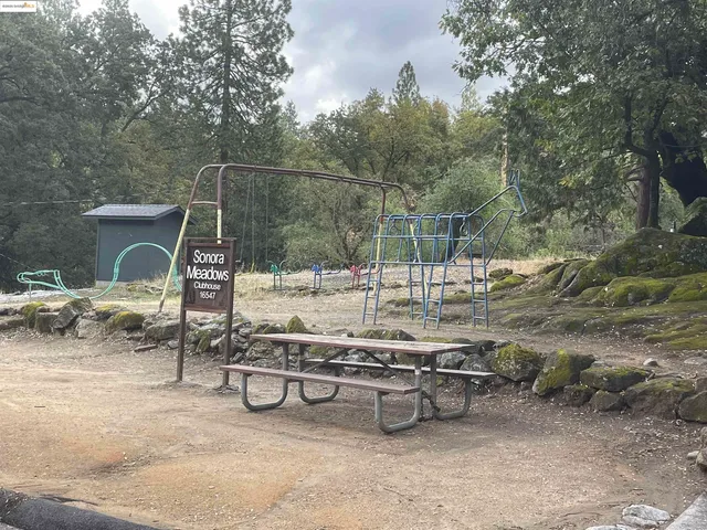 a view of a backyard with sitting area