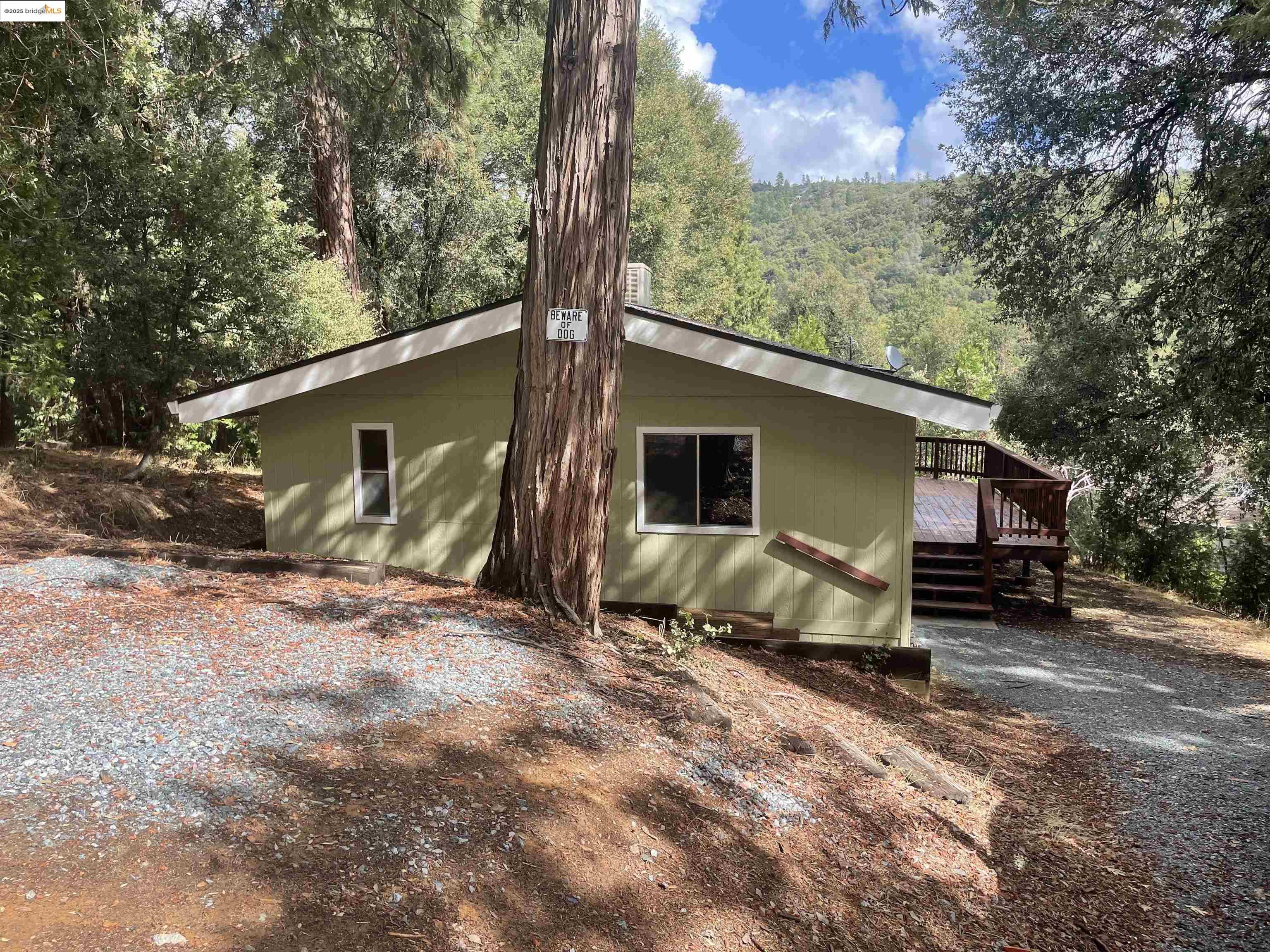 21818 Fallview Drive Sonora, CA 95370 - Photo 4 of 21 a view of a house with backyard and a tree