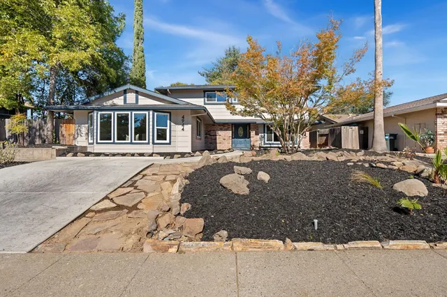 a front view of a building with a yard
