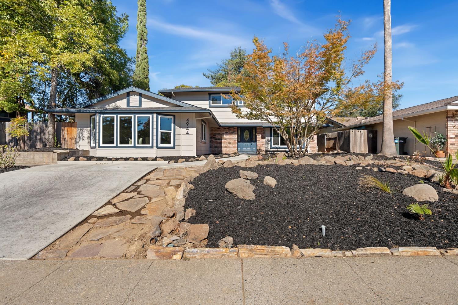 a front view of a building with a yard