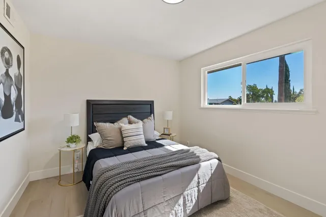 a bedroom with a bed and a window