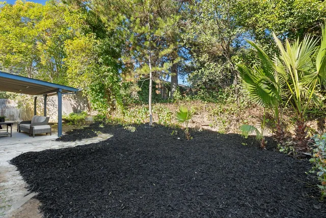 a backyard of a house with lots of green space