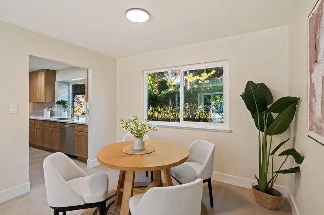 a dining room with furniture and window