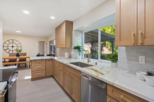 a kitchen with sink and cabinets