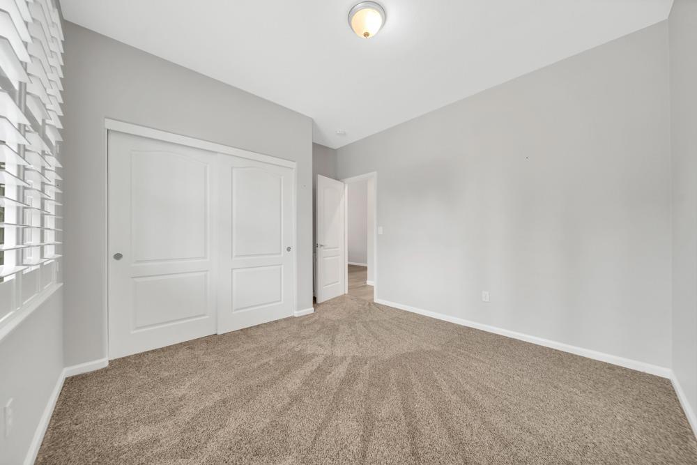 20300 Panoz Road Patterson, CA 95363 - Photo 13 of 60 Downstairs Back Bedroom