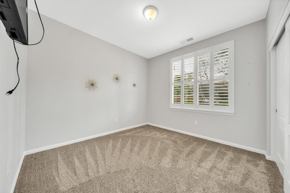 20300 Panoz Road Patterson, CA 95363 - Photo 14 of 60 Downstairs Front Bedroom - TV stays with home