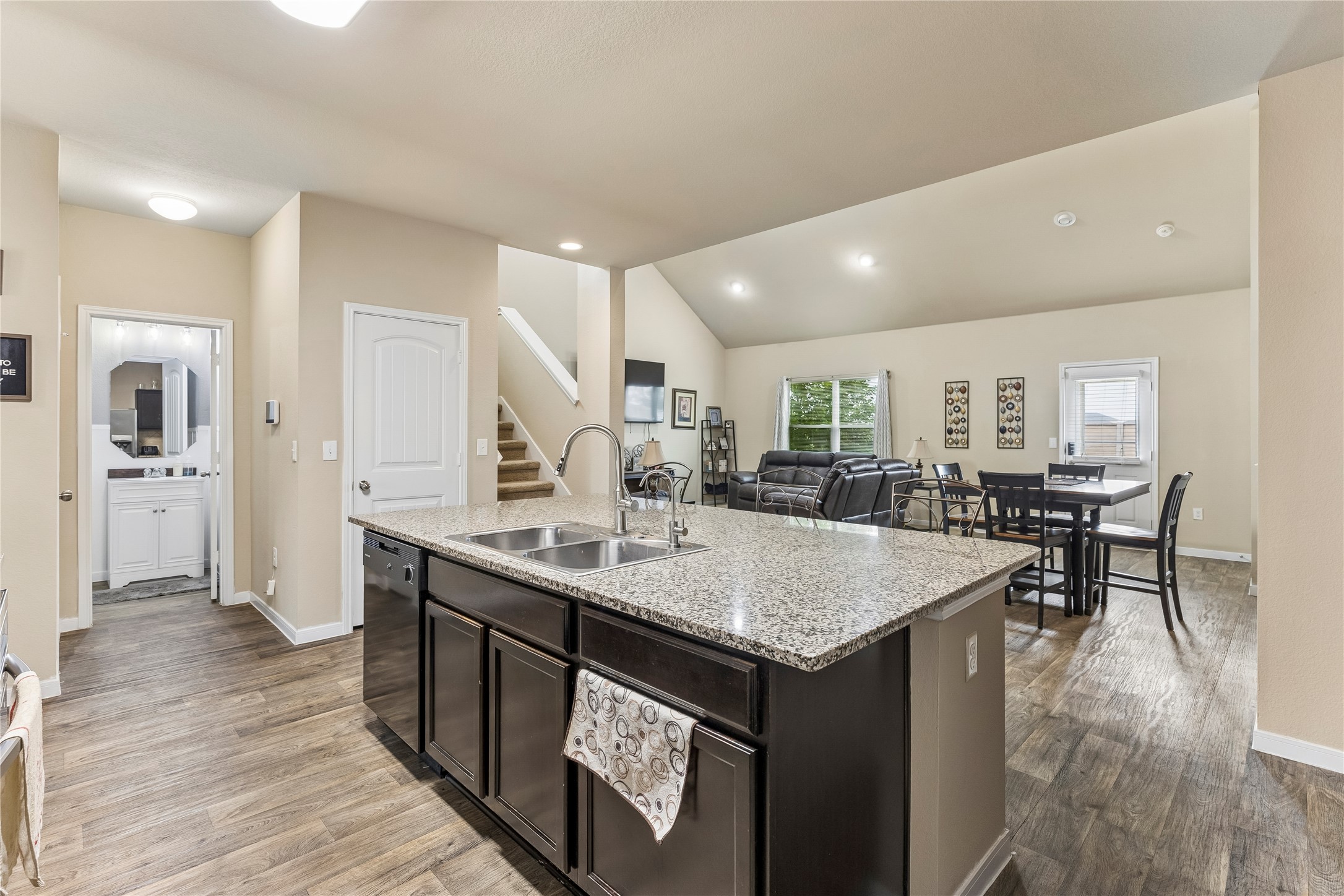14409 Estuary Road Manor, TX 78653 - Photo 14 of 24 Spacious kitchen island featuring a granite countertop and dual basin stainless steel sink