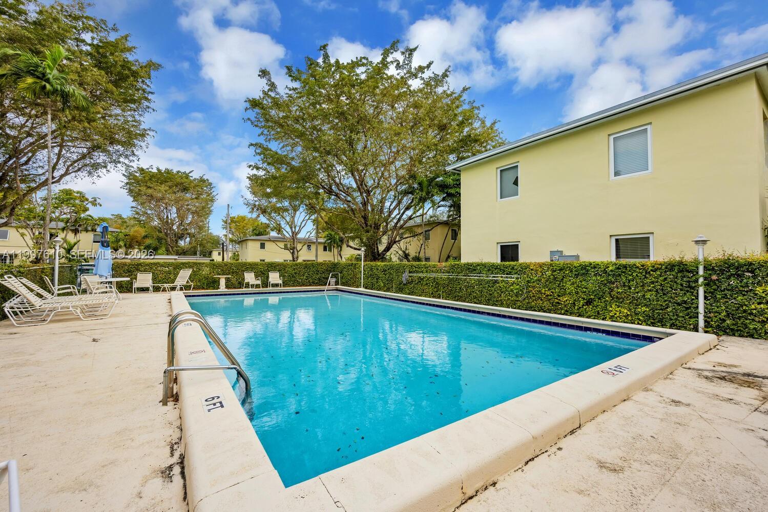 5510 Southwest 76th Street, Unit C Miami, FL 33143 - Photo 14 of 14 a view of swimming pool with a yard