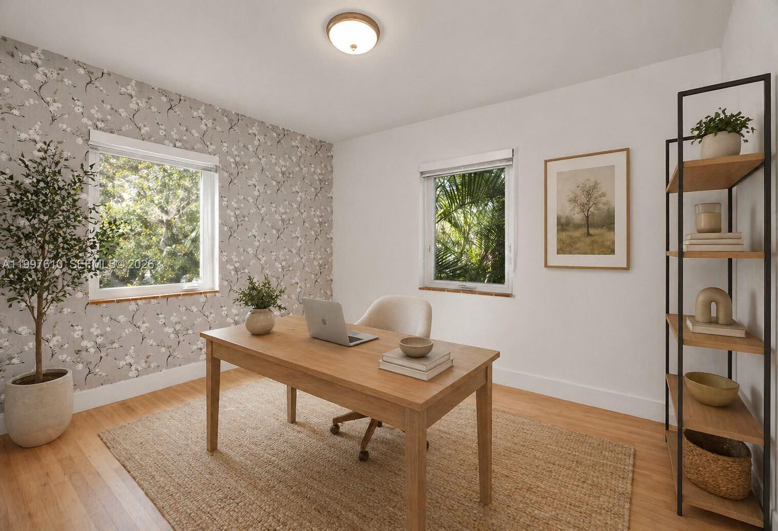 5510 Southwest 76th Street, Unit C Miami, FL 33143 - Photo 8 of 14 a view of a workspace with furniture and a window