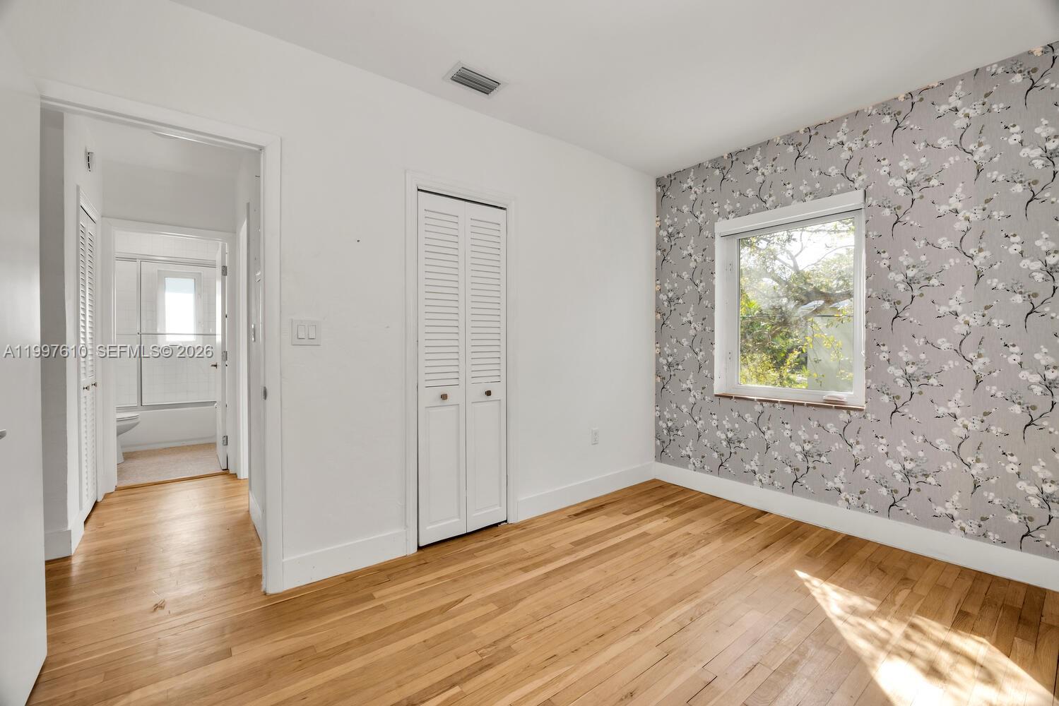 5510 Southwest 76th Street, Unit C Miami, FL 33143 - Photo 9 of 14 wooden floor in an empty room