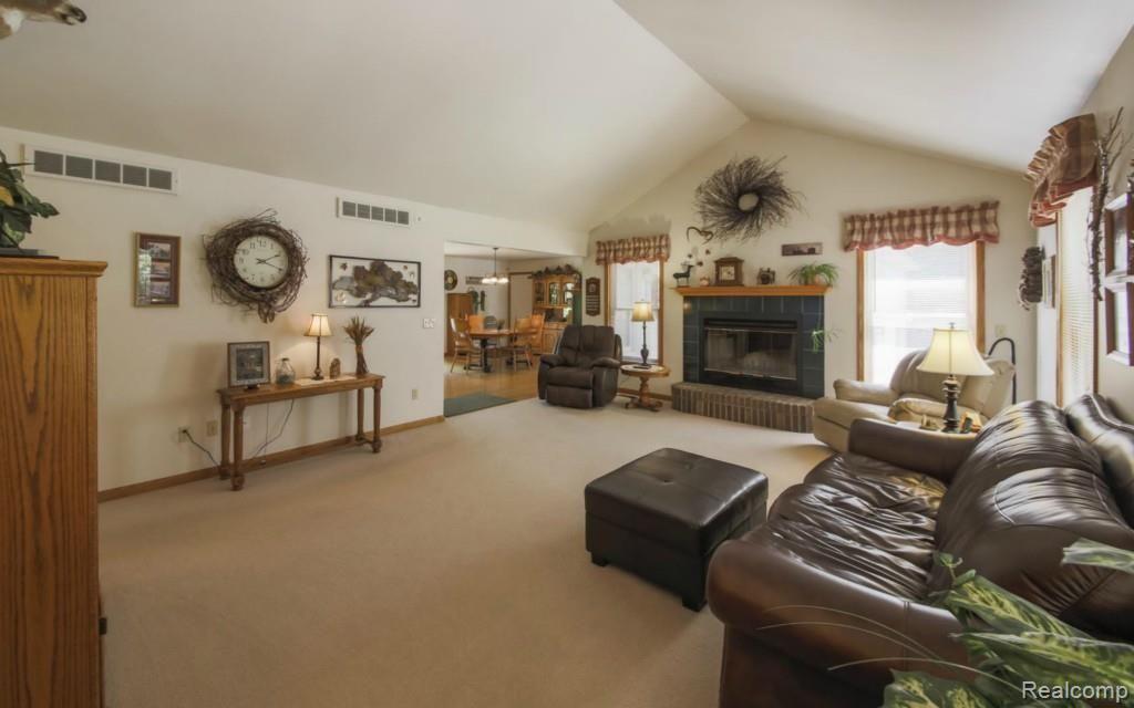 5713 Dutcher Road Howell, MI 48843 - Photo 7 of 33 Great room with fireplace