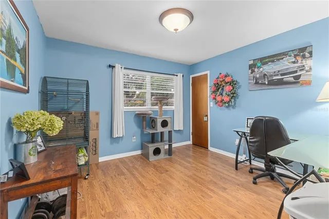 a bedroom with a workspace