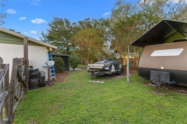 a view of a backyard with sitting area
