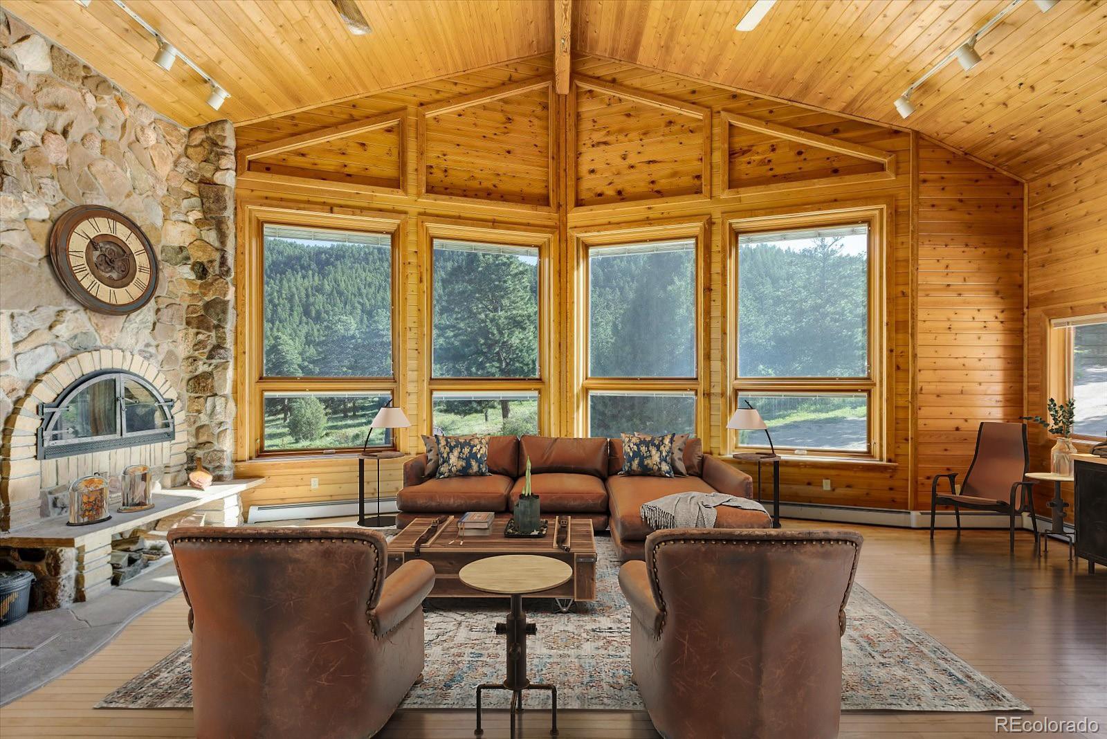 283 Chute Road Golden, CO 80403 - Photo 11 of 40 a dining room with furniture and a floor to ceiling window