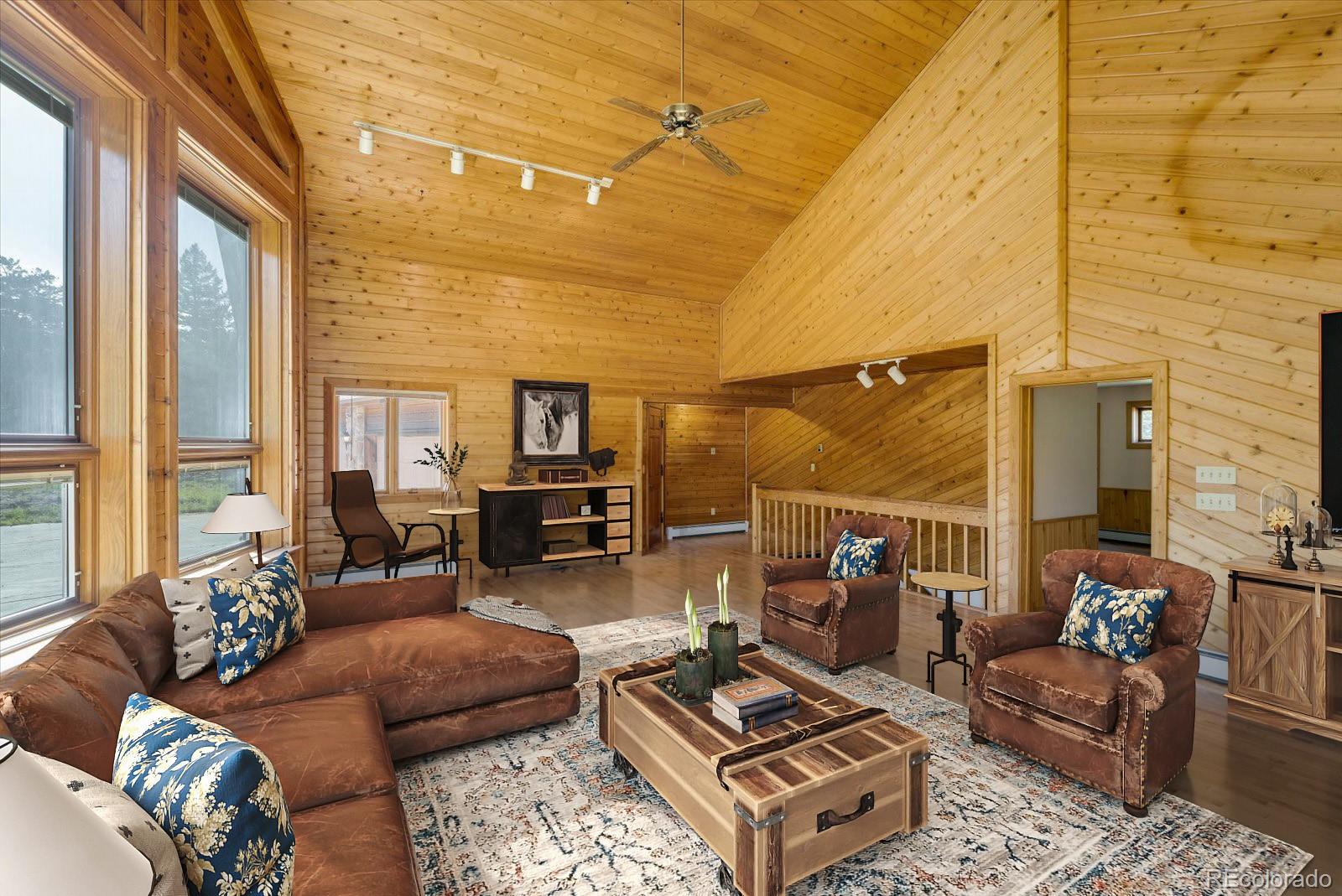 283 Chute Road Golden, CO 80403 - Photo 12 of 40 a living room with furniture and a floor to ceiling window