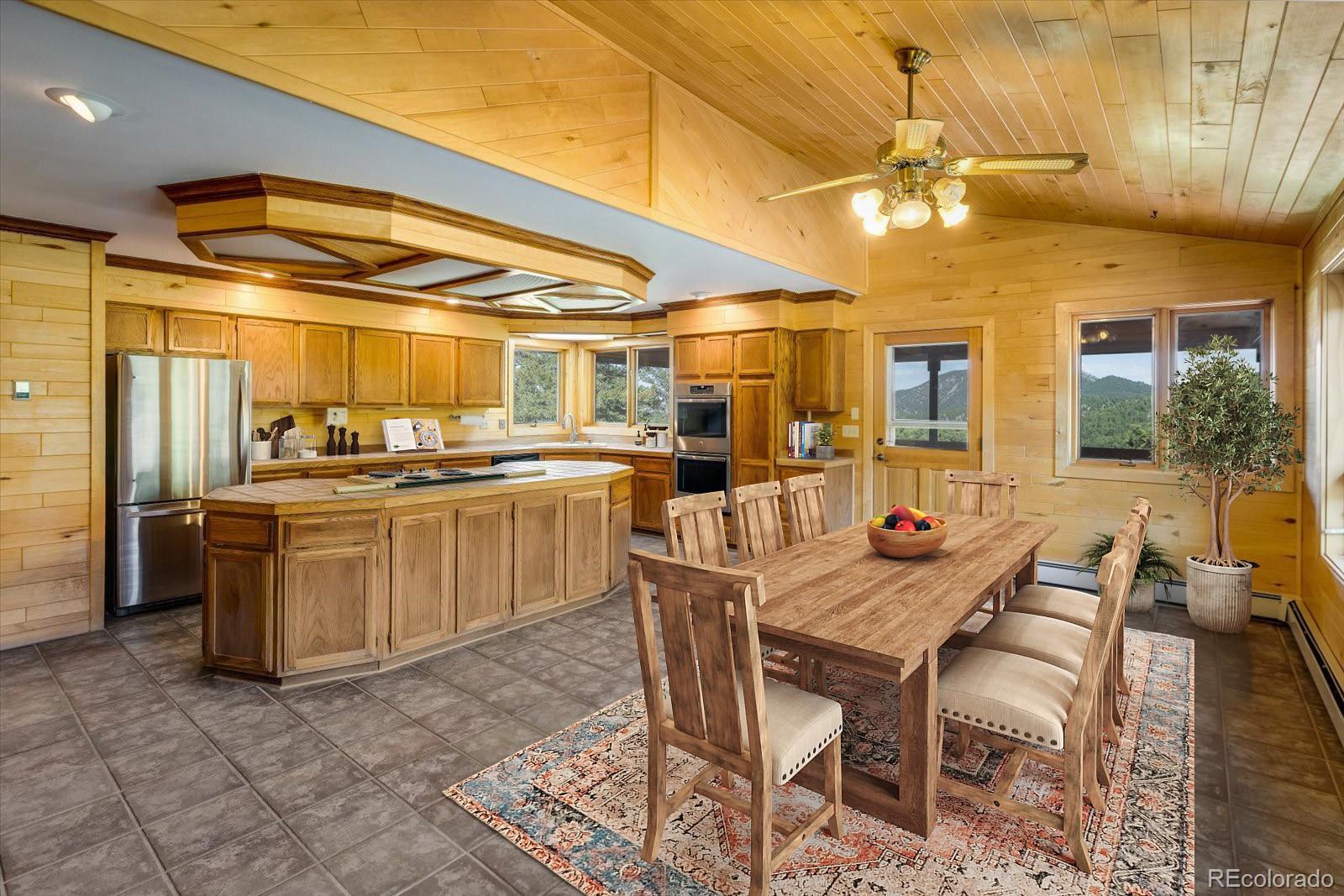 283 Chute Road Golden, CO 80403 - Photo 17 of 40 a kitchen with a table and chairs
