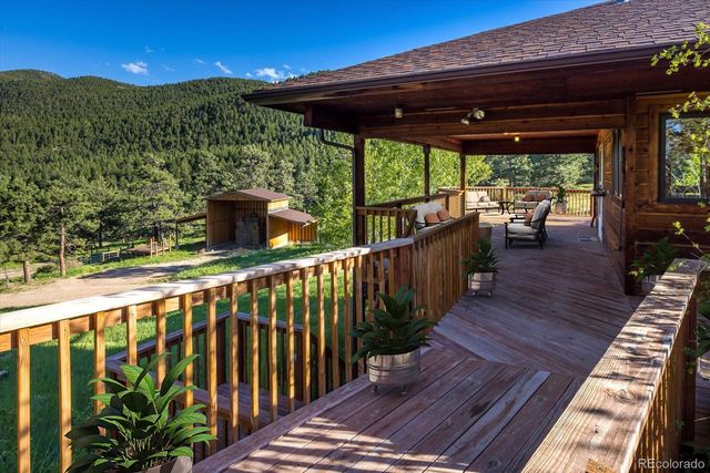 a view of a patio with wooden floor
