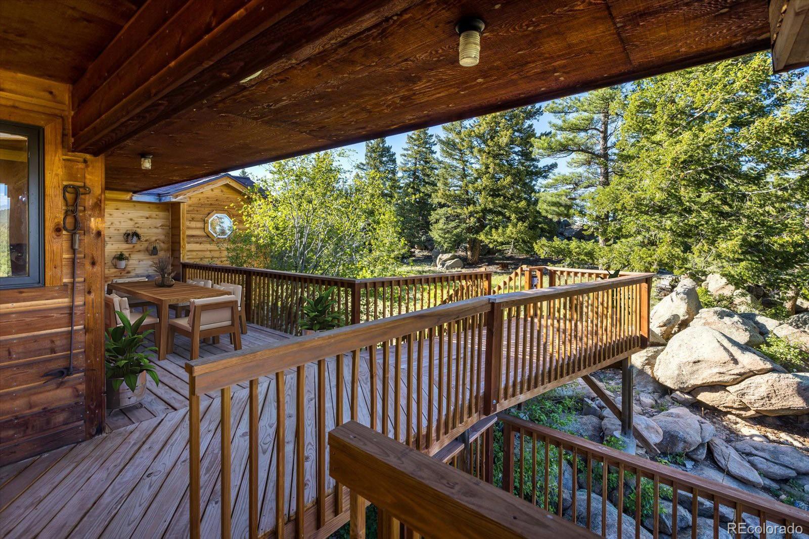 283 Chute Road Golden, CO 80403 - Photo 19 of 40 a view of a balcony with wooden floor