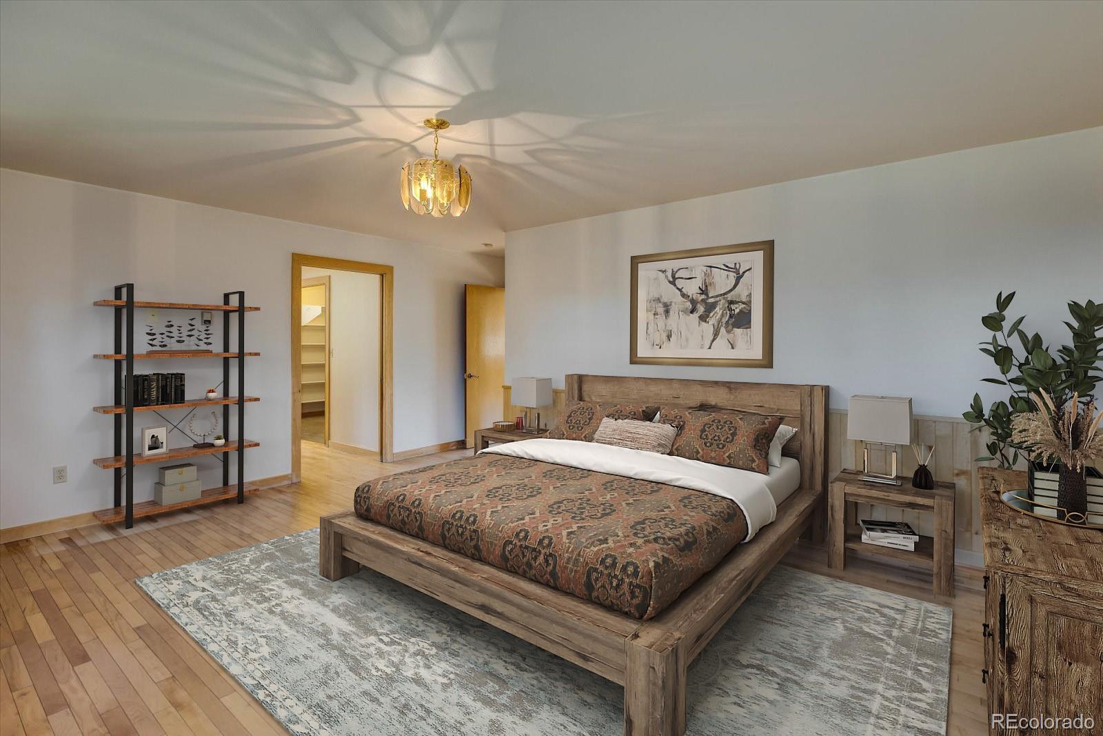 283 Chute Road Golden, CO 80403 - Photo 23 of 40 a bedroom with a large bed closet and a window