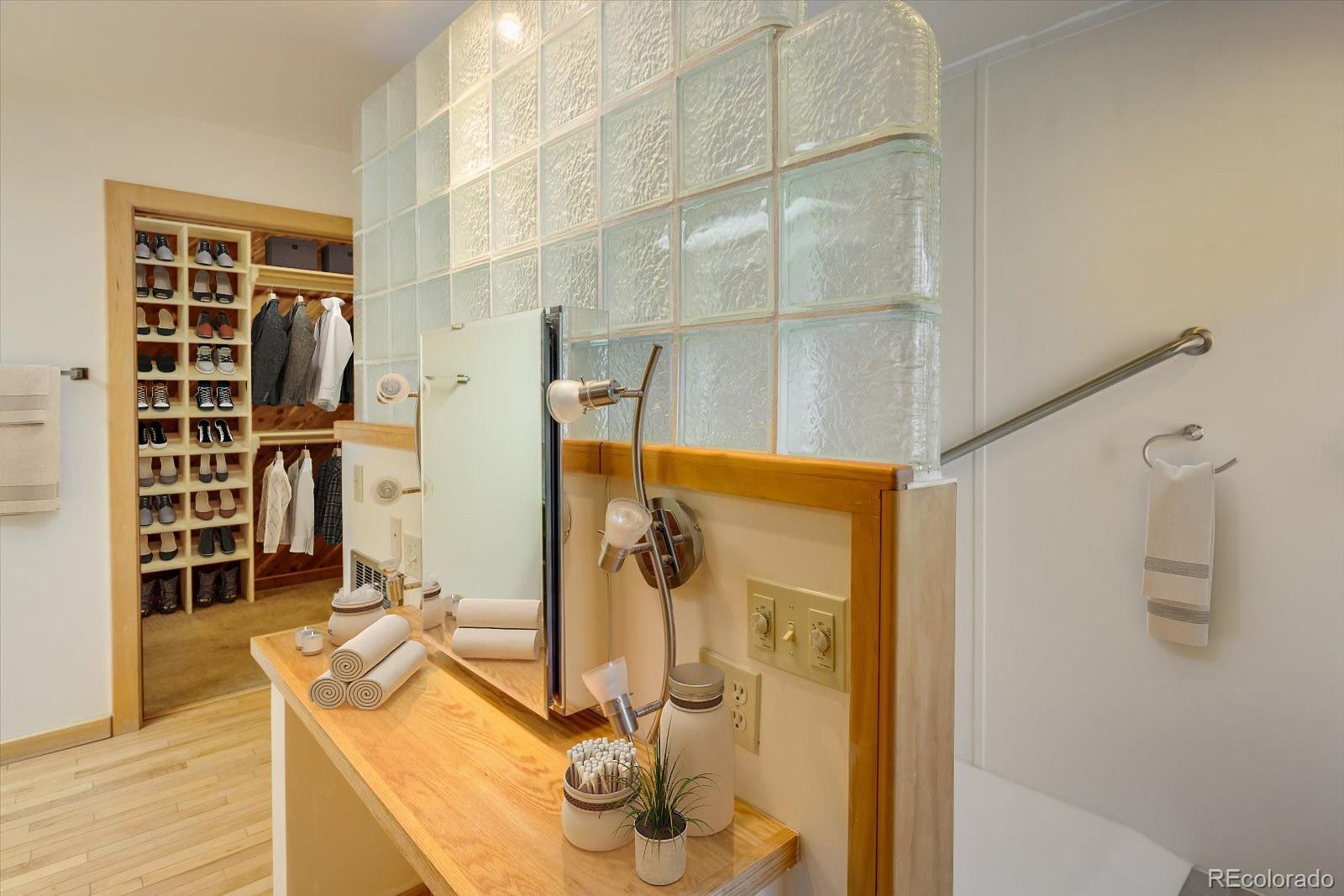 283 Chute Road Golden, CO 80403 - Photo 25 of 40 a bathroom with a double vanity sink and shower