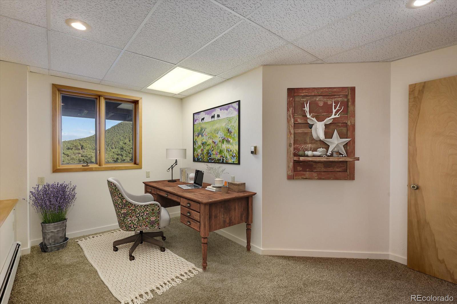 283 Chute Road Golden, CO 80403 - Photo 33 of 40 a view of a workspace with furniture and a window