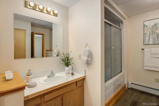 a en suite bathroom with a sink and a mirror