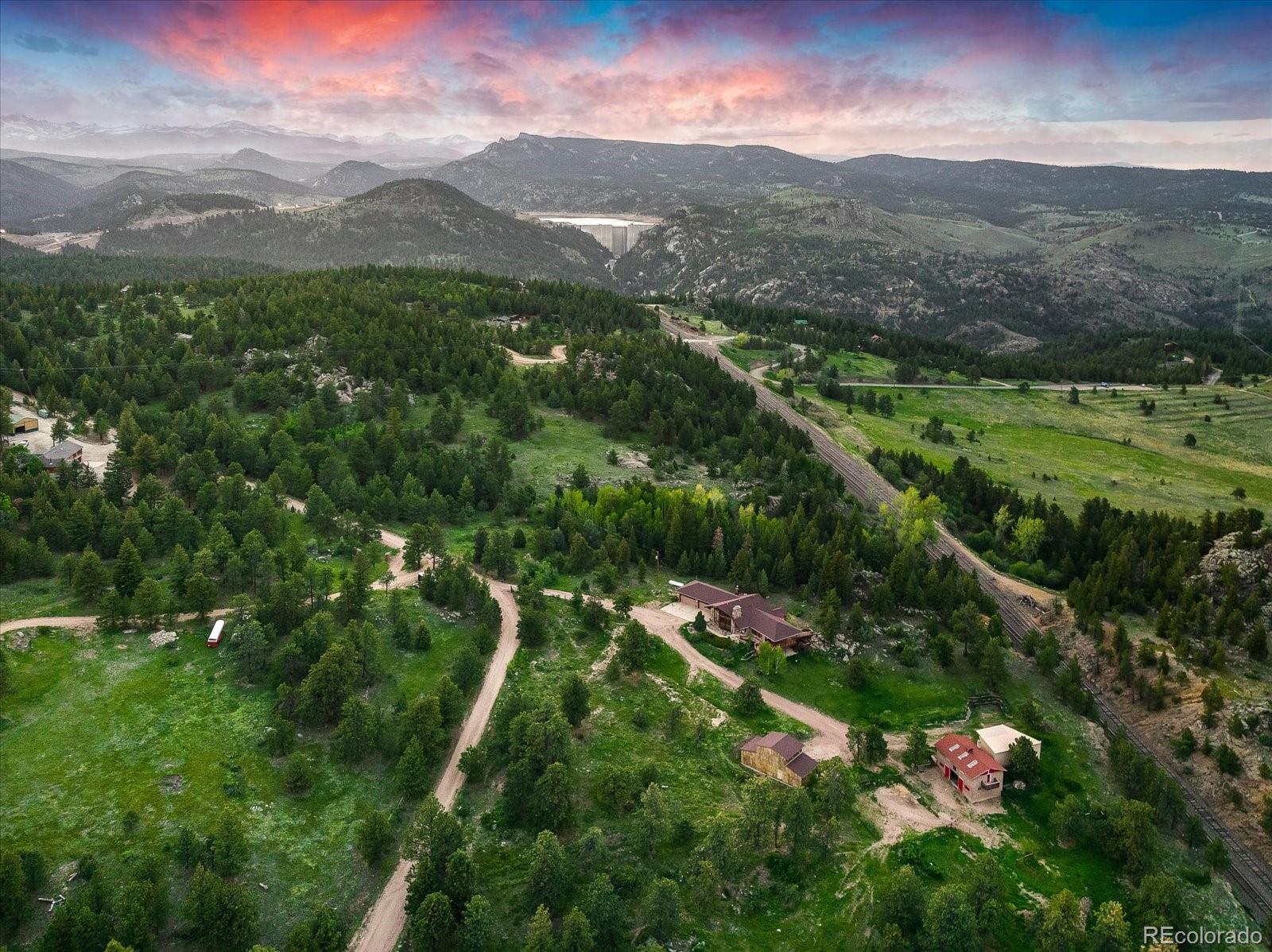 283 Chute Road Golden, CO 80403 - Photo 40 of 40 a view of a lush green hillside and houses