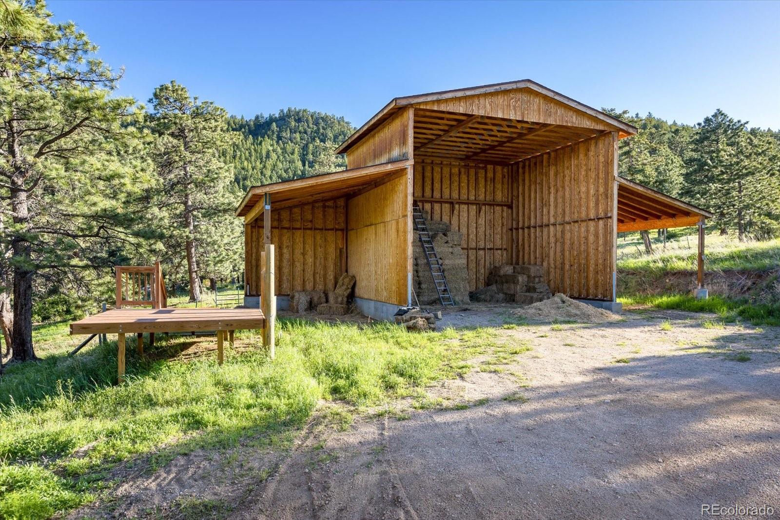 283 Chute Road Golden, CO 80403 - Photo 6 of 40 a view of a house with backyard and sitting area