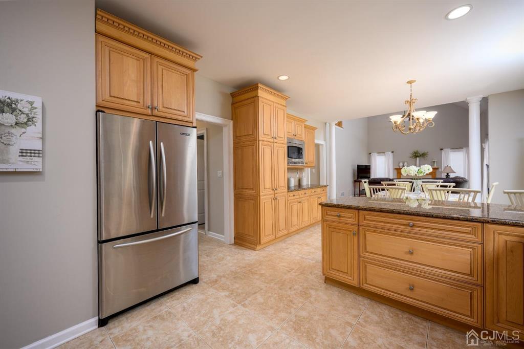 133 Thomas Drive Clark, NJ 07066 - Photo 12 of 30 a kitchen with stainless steel appliances a refrigerator sink and cabinets