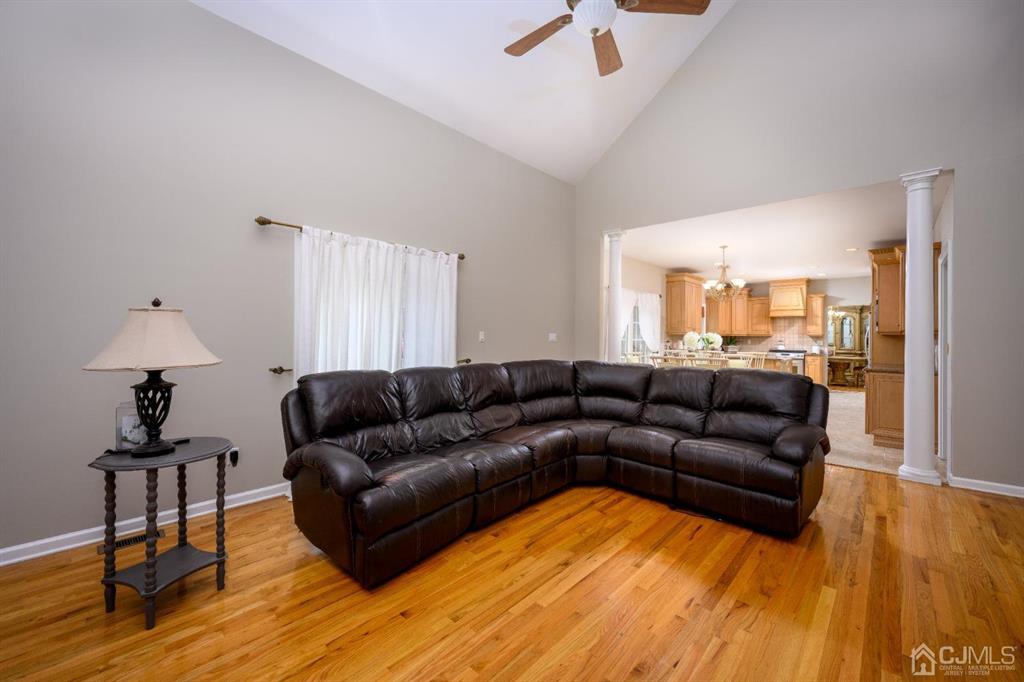 133 Thomas Drive Clark, NJ 07066 - Photo 16 of 30 a living room with furniture and a wooden floor