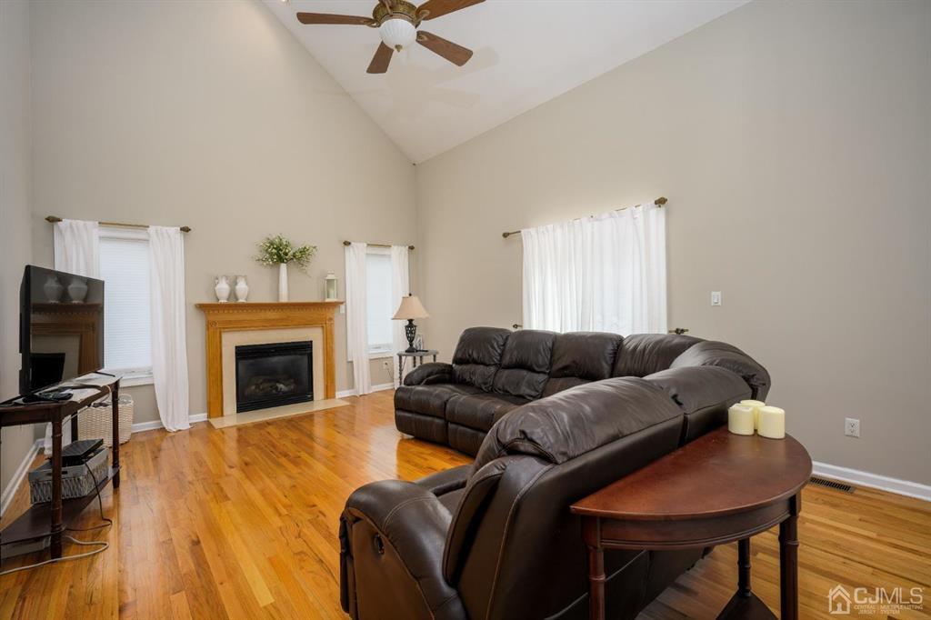 133 Thomas Drive Clark, NJ 07066 - Photo 17 of 30 a living room with furniture and a fireplace