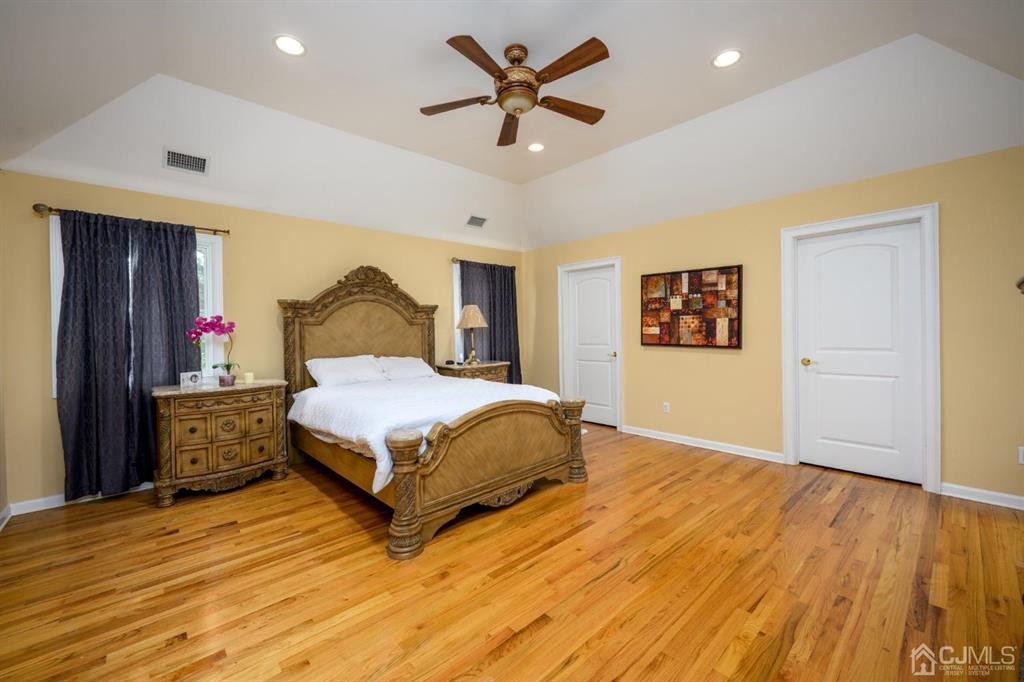 133 Thomas Drive Clark, NJ 07066 - Photo 20 of 30 a spacious bedroom with a bed and a dresser