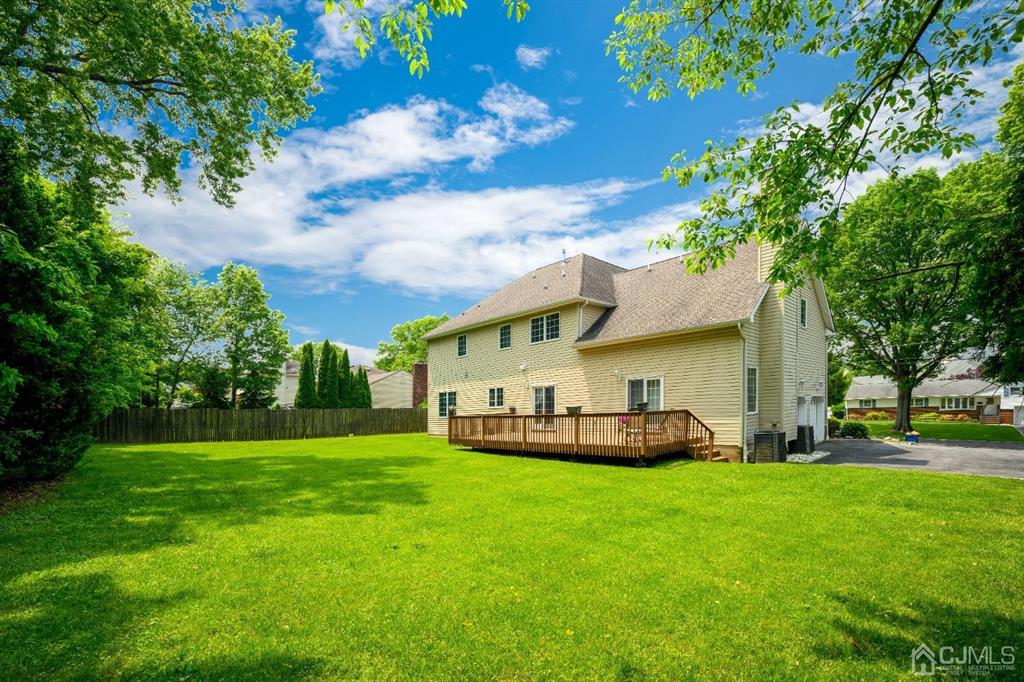 133 Thomas Drive Clark, NJ 07066 - Photo 28 of 30 a view of a house with a big yard and large trees