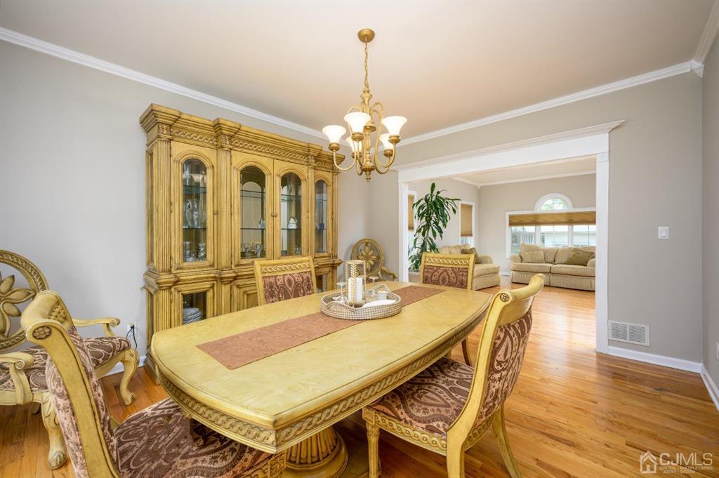 133 Thomas Drive Clark, NJ 07066 - Photo 9 of 30 a view of a dining room with furniture and wooden floor