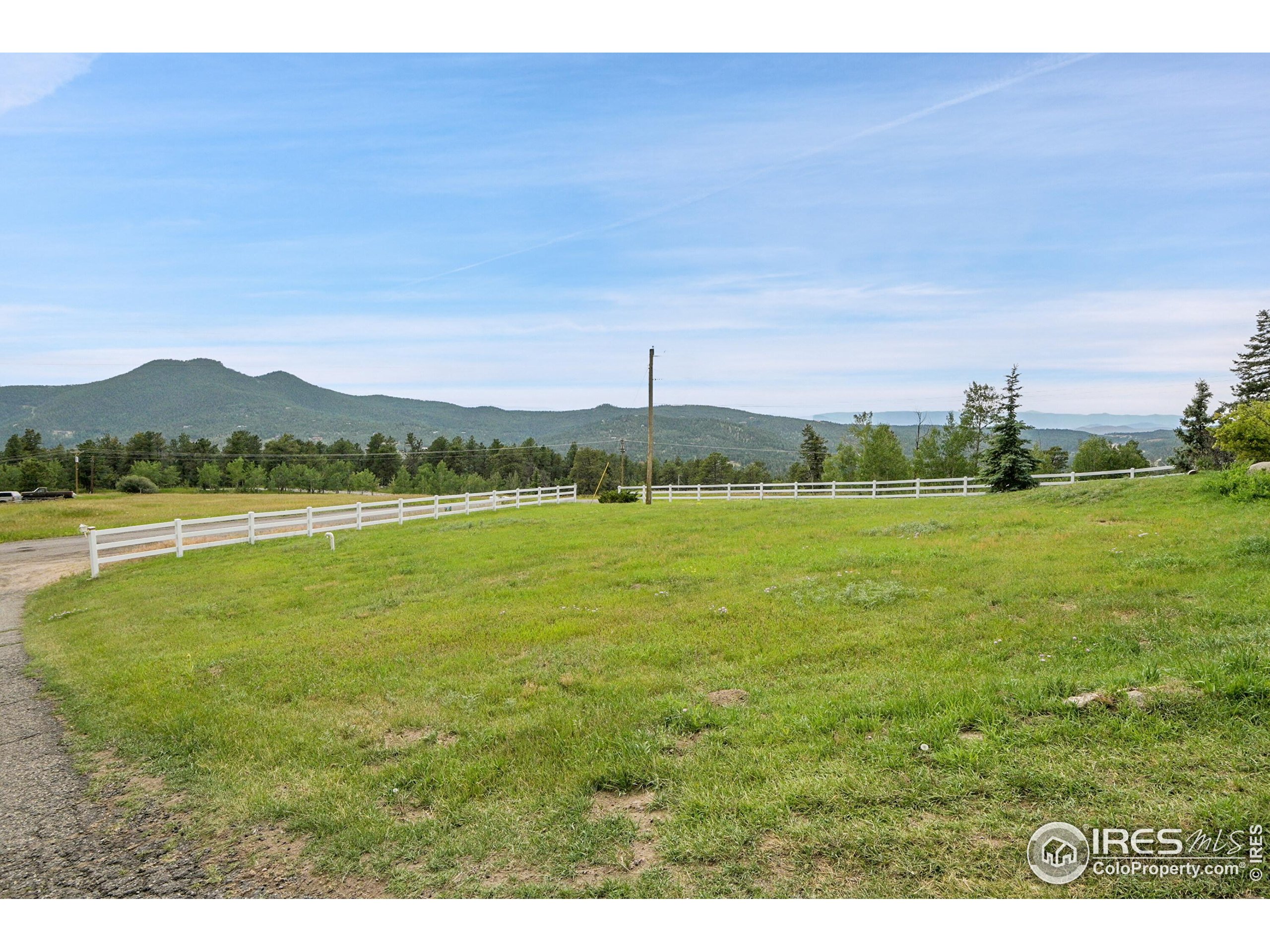 24927 Agate Avenue Conifer, CO 80433 - Photo 11 of 33 a view of a lake with a mountain in the background