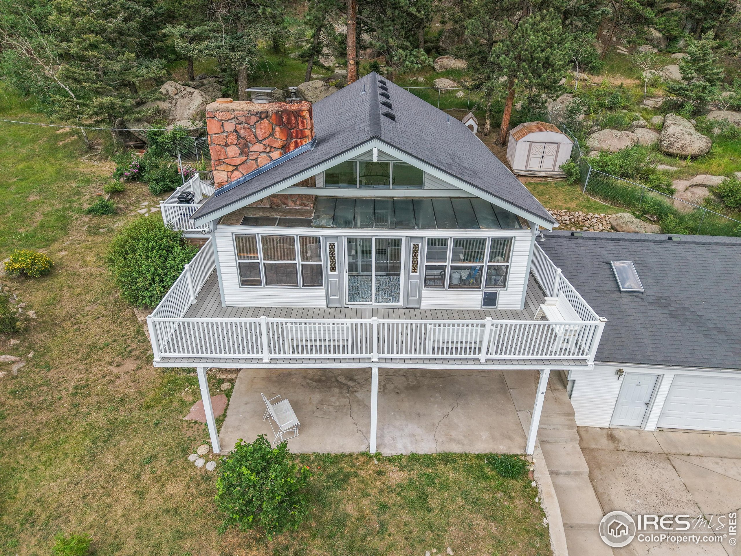 24927 Agate Avenue Conifer, CO 80433 - Photo 13 of 33 a front view of a house with a yard