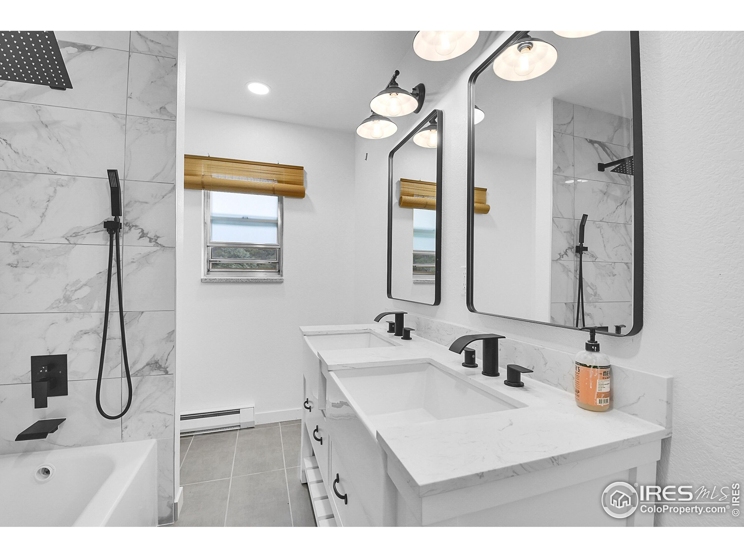 24927 Agate Avenue Conifer, CO 80433 - Photo 15 of 33 a bathroom with a sink vanity and mirror