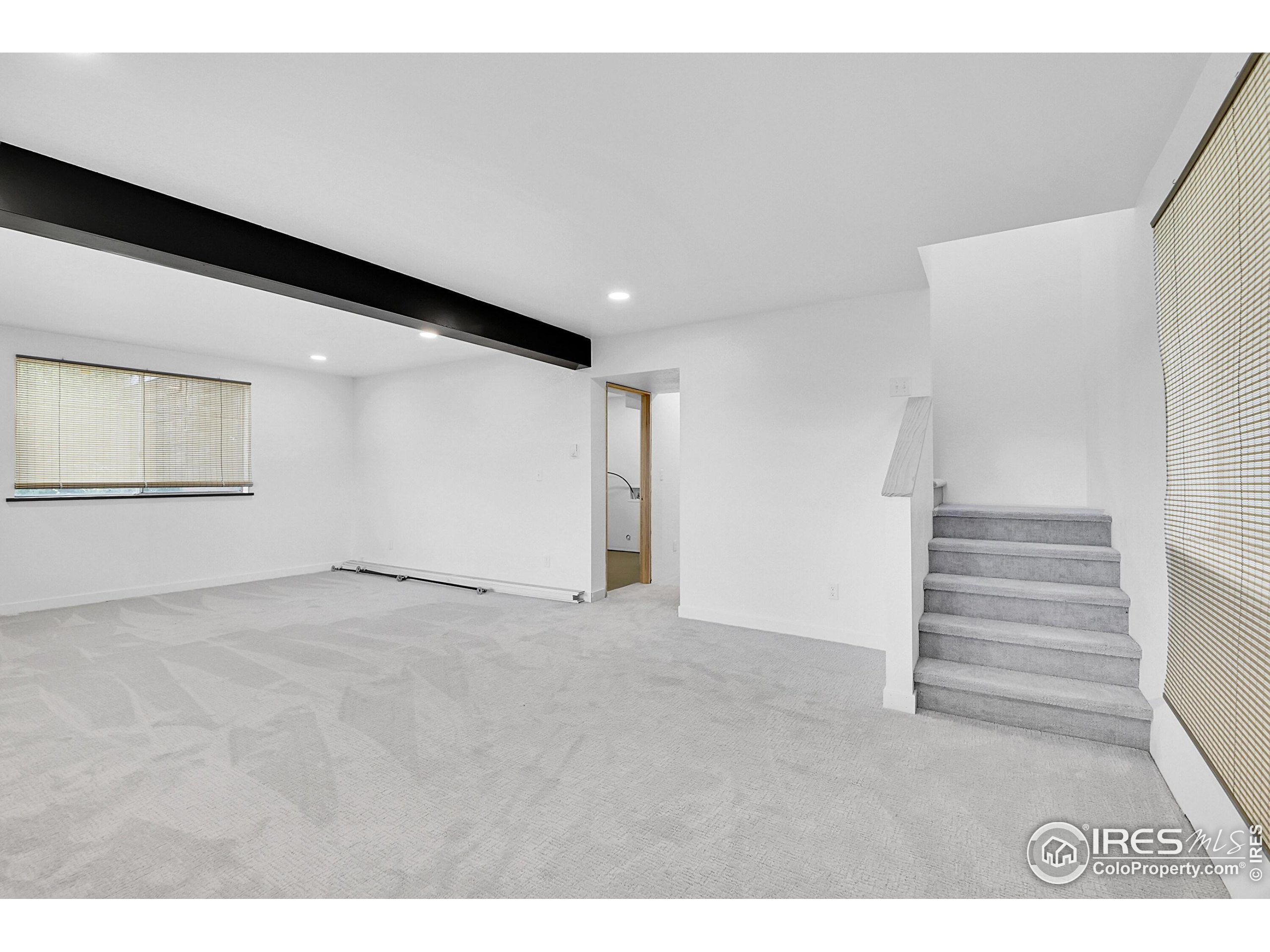 24927 Agate Avenue Conifer, CO 80433 - Photo 16 of 33 a view of an empty room with stairs