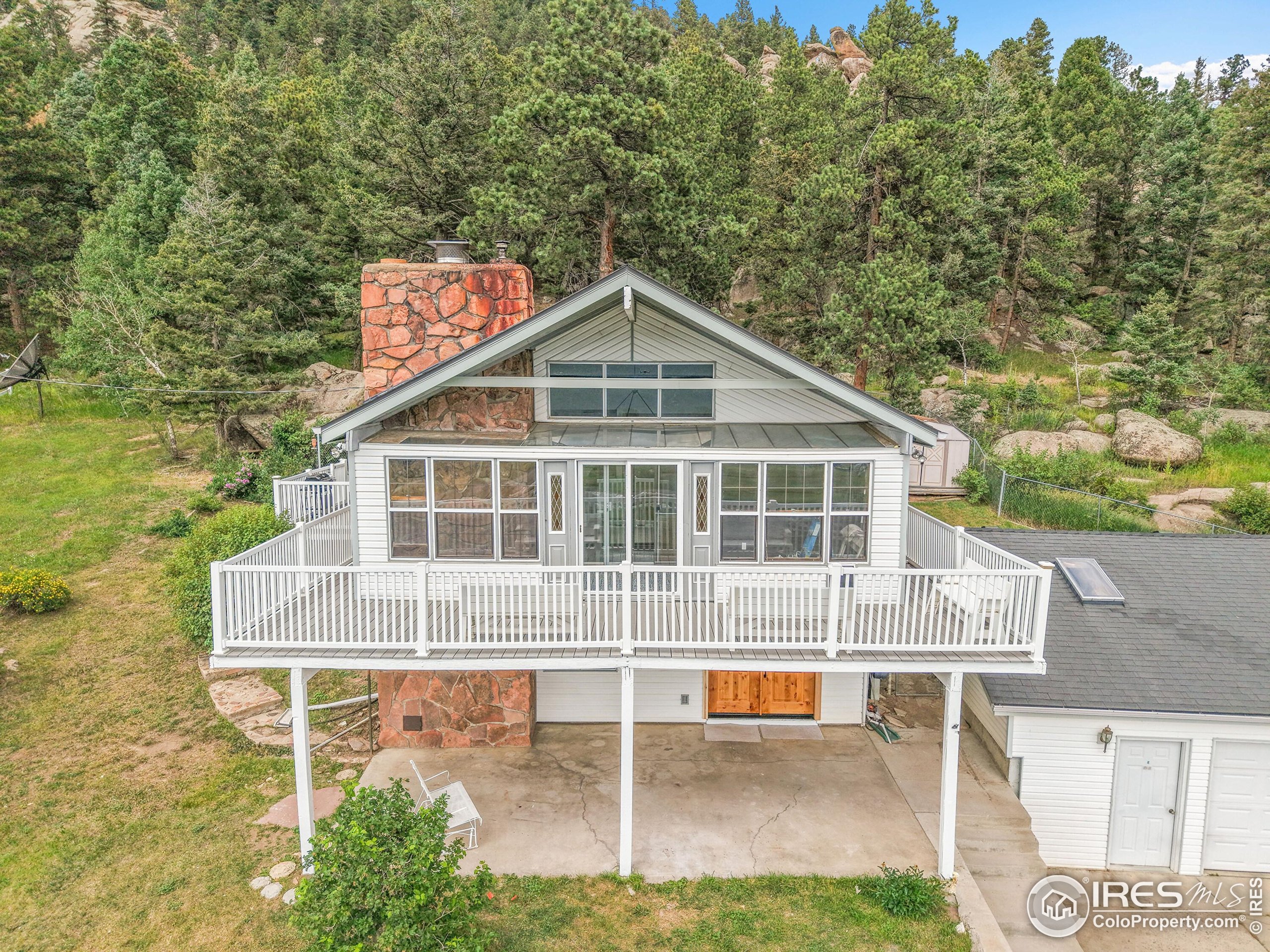 24927 Agate Avenue Conifer, CO 80433 - Photo 2 of 33 a view of a house with a yard