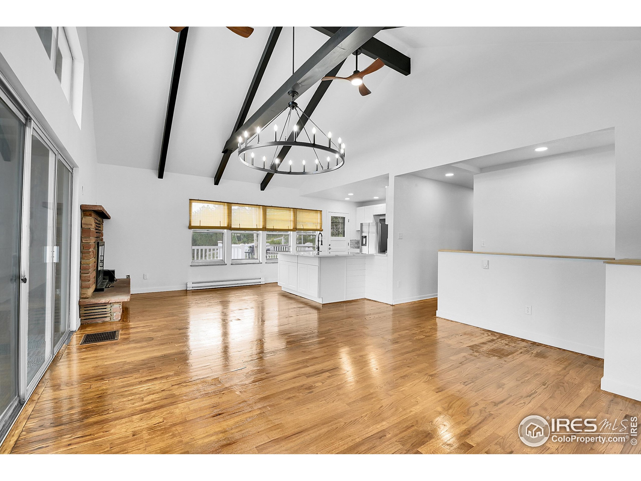24927 Agate Avenue Conifer, CO 80433 - Photo 30 of 33 a view of empty room with wooden floor