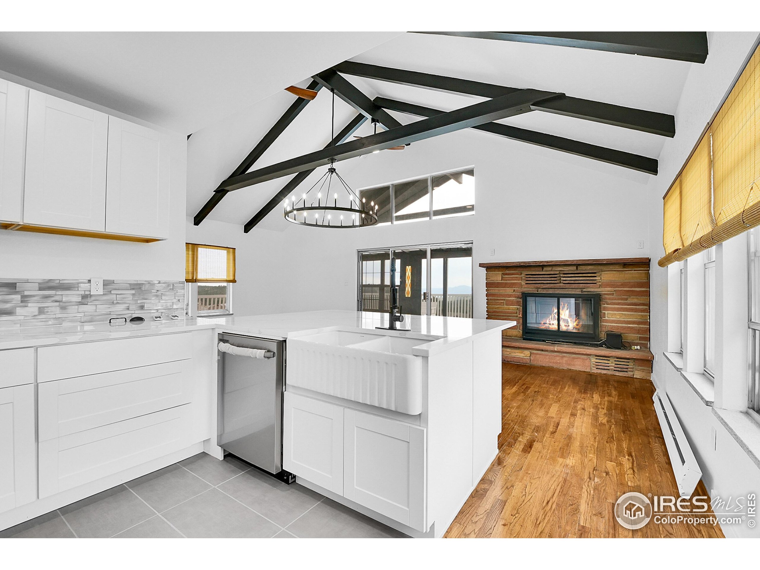 24927 Agate Avenue Conifer, CO 80433 - Photo 31 of 33 a view of living room with granite countertop furniture and a kitchen view