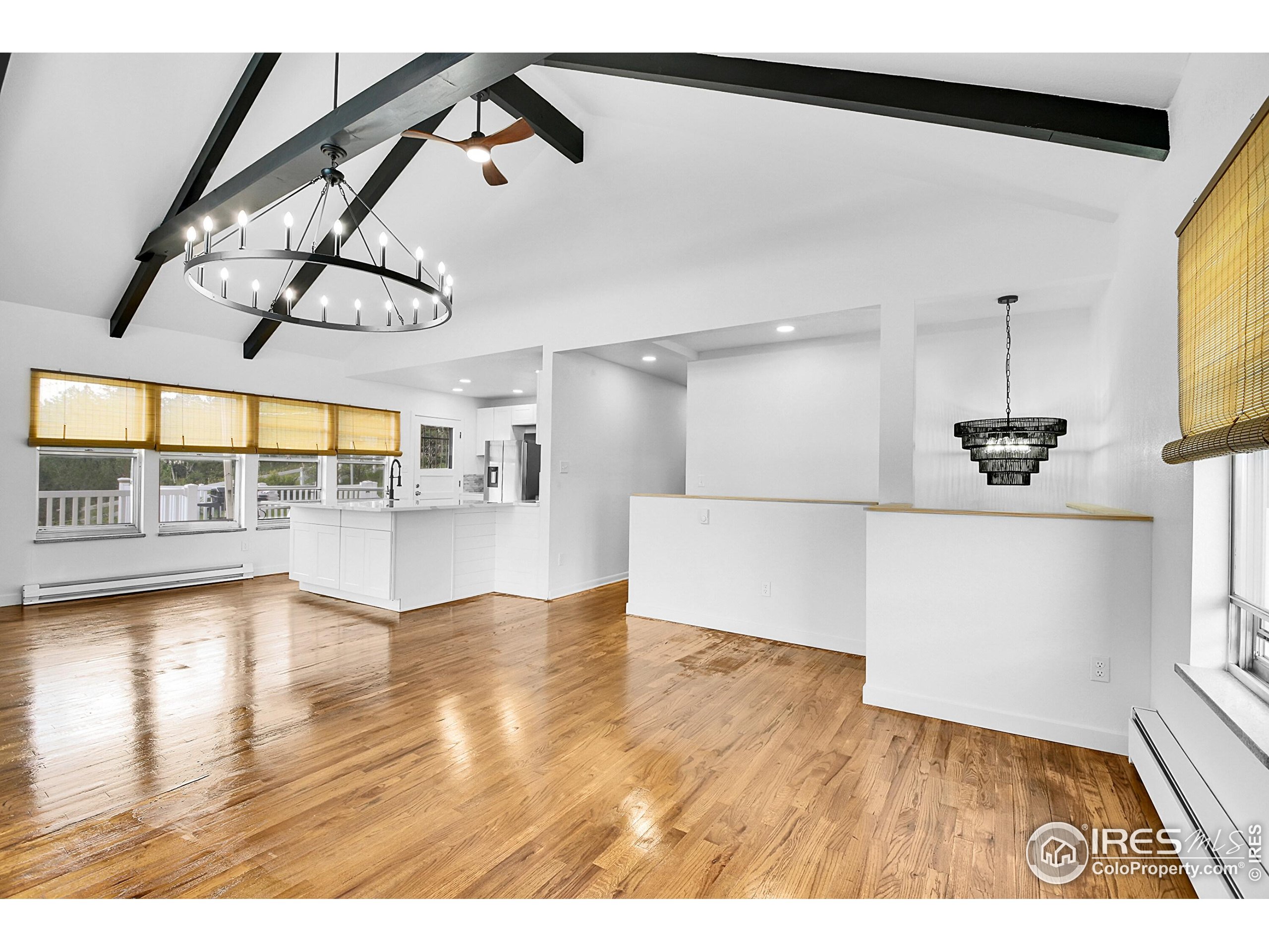 24927 Agate Avenue Conifer, CO 80433 - Photo 32 of 33 a view of an empty room with a window and wooden floor