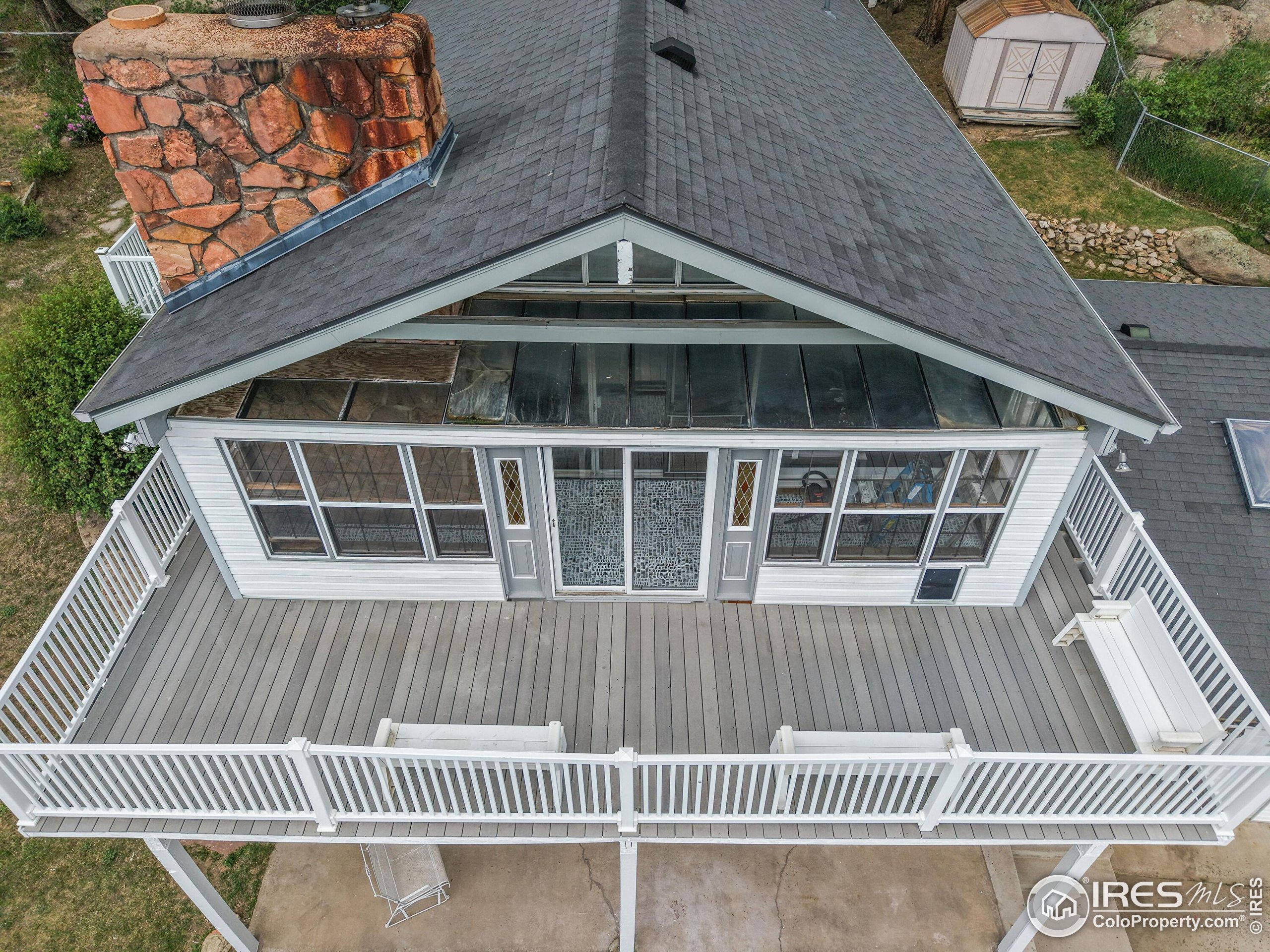 24927 Agate Avenue Conifer, CO 80433 - Photo 6 of 33 a view of a house with a deck