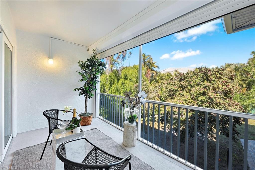 4180 Crayton Road, Unit E8 Naples, FL 34103 - Photo 13 of 20 a view of balcony with furniture