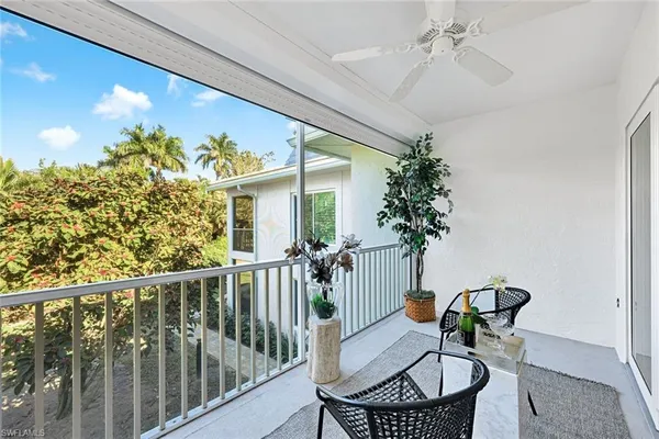 a view of a balcony with furniture