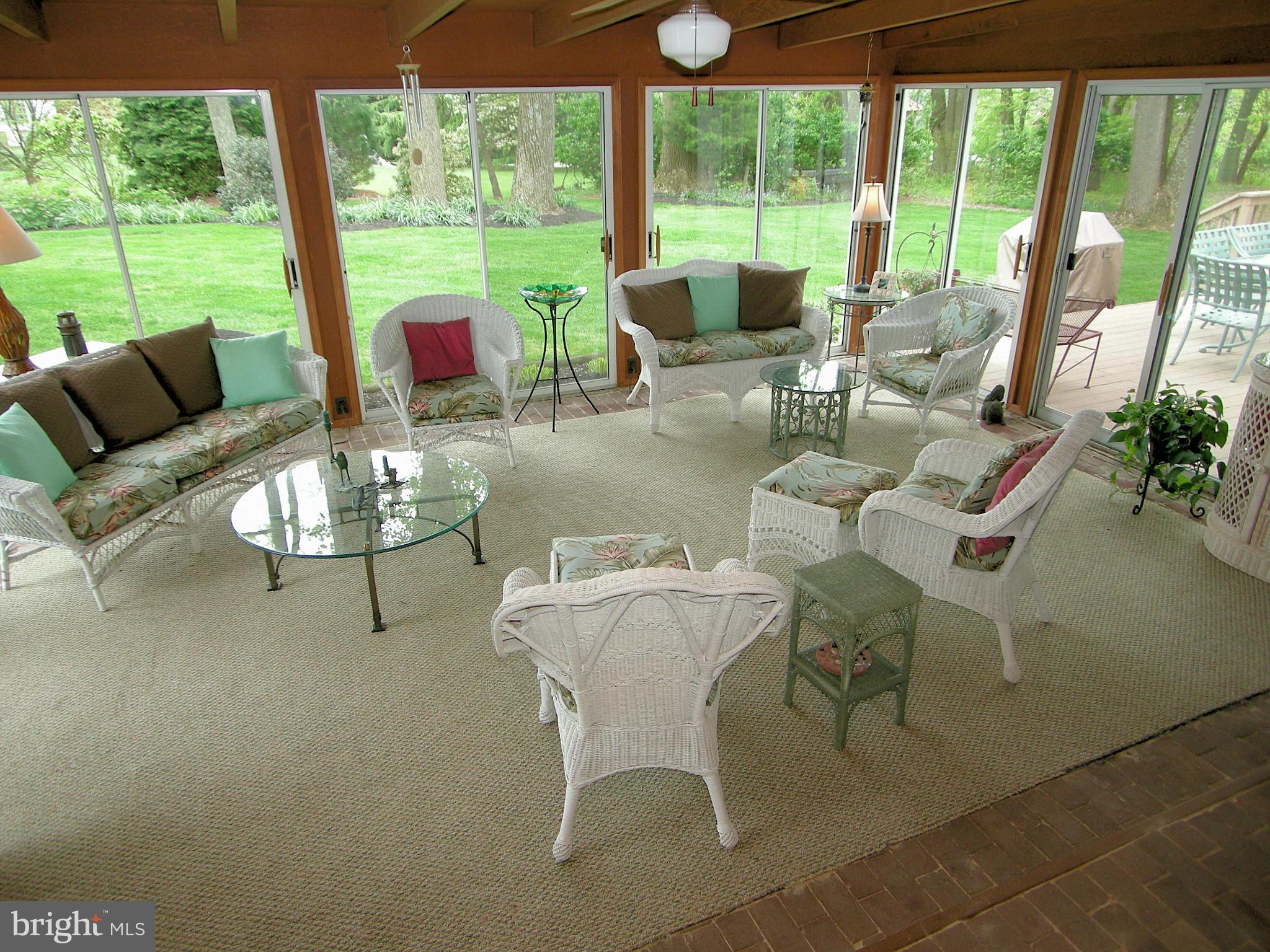 13909 Foxland Road Phoenix, MD 21131 - Photo 11 of 27 a dining room with furniture water view and a floor to ceiling window