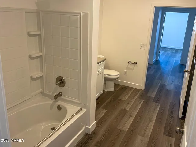 a bathroom with a tub and sink