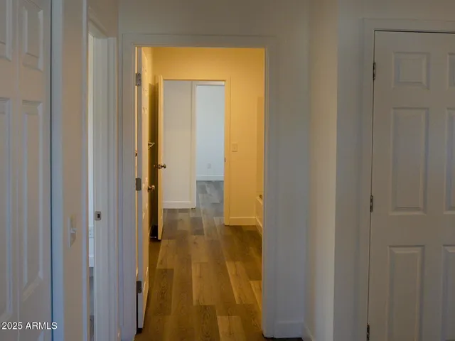 a view of a bathroom from a hallway