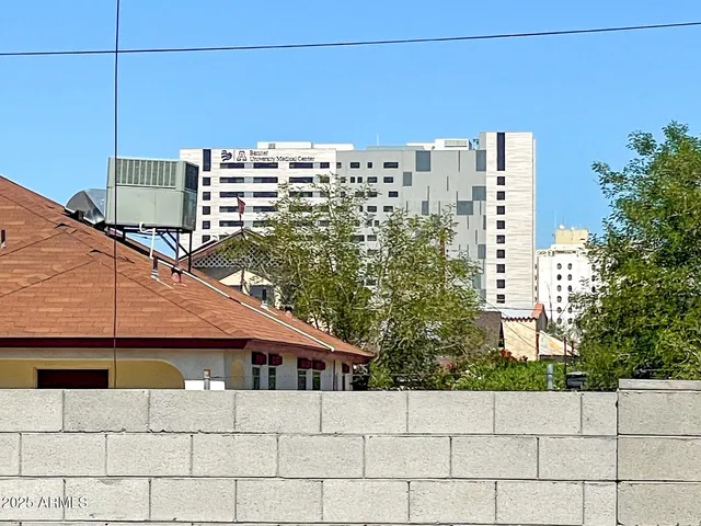 a view of car parked on the side of the road